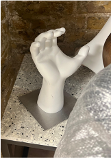 hand on metal base